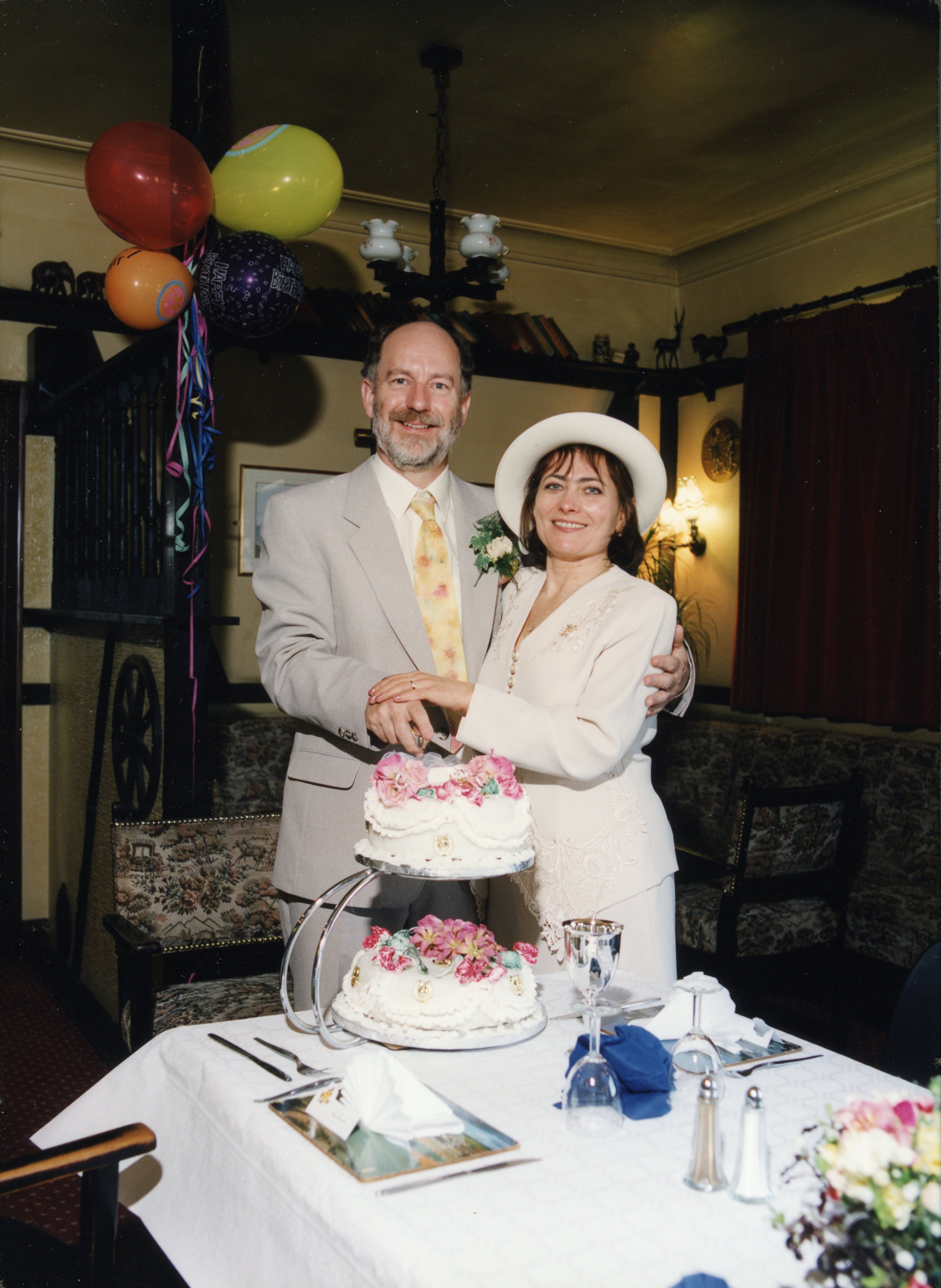 Paul & Irina with wedding cake at the reception in The Odd Wheel