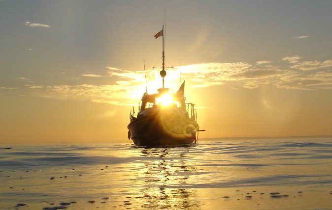 Aquanauts boat at sunset